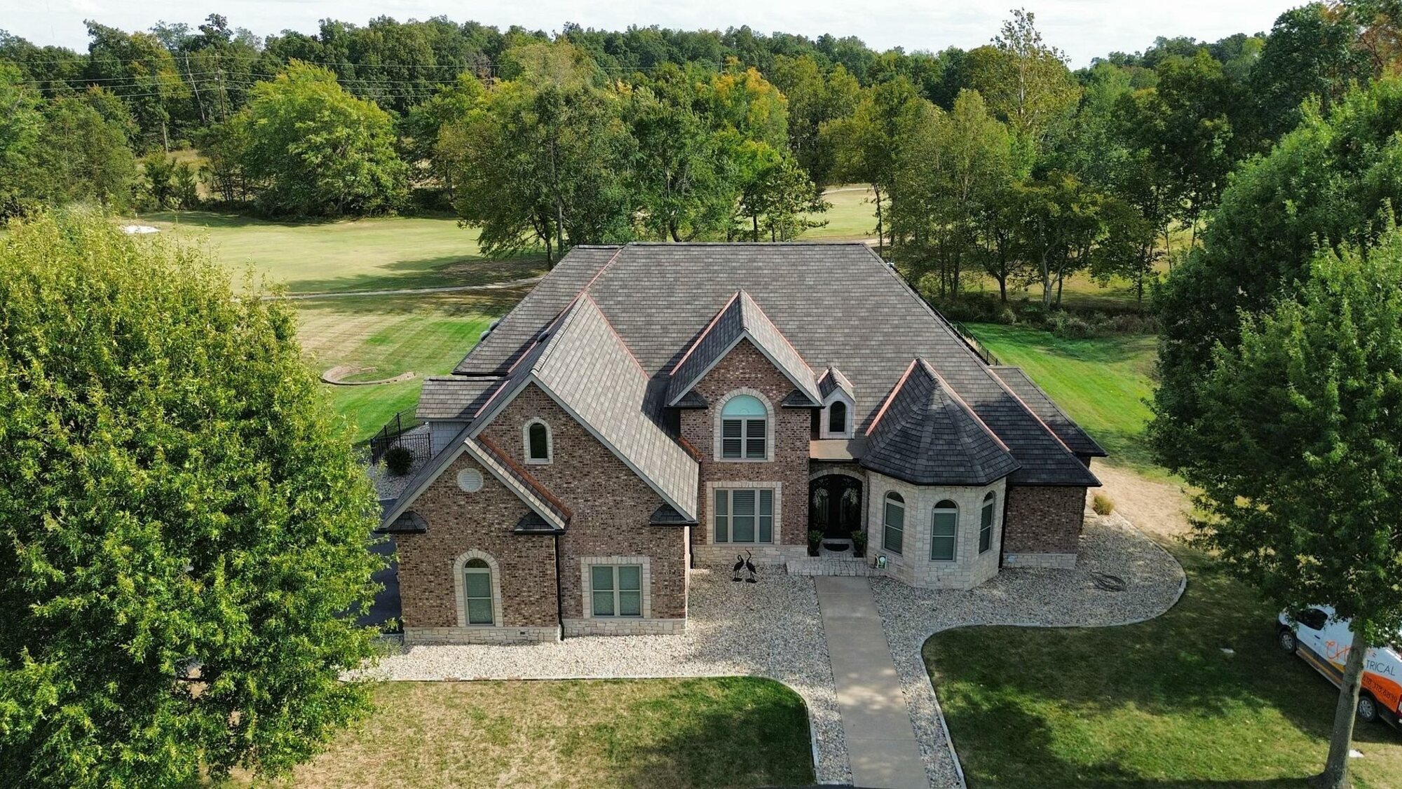 Completed residential roofing project — front exterior view